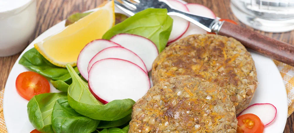 vegetarian cutlets with fresh salad on the plate, top view