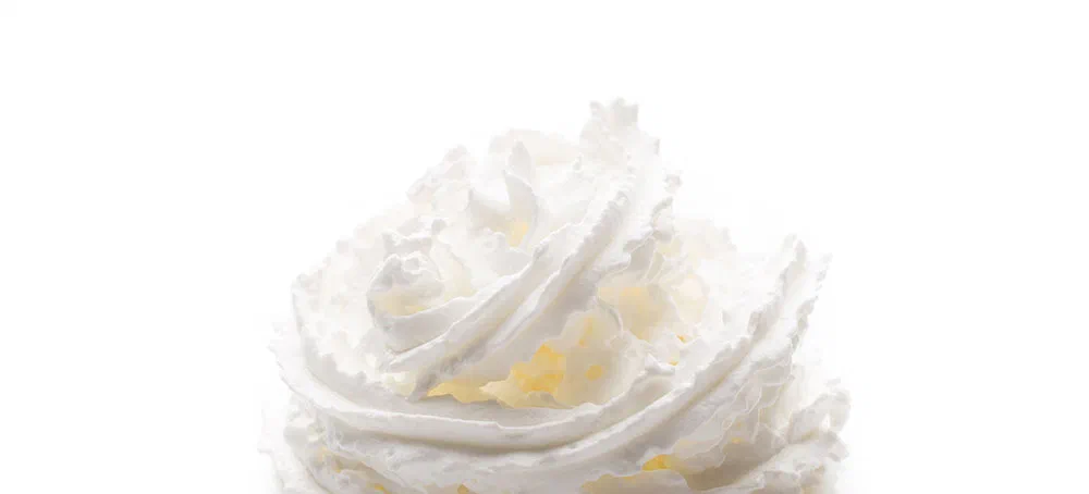 Whipped cream isolated on the vhite background.